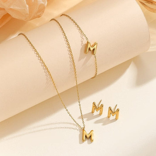 Gilded signature alphabet jewellery set